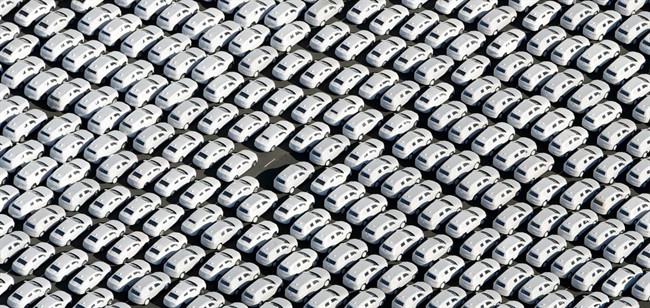 In this Sept. 30, 2015 file photo new cars of Volkswagen AG stand at the car terminal in Emden, Germany. 