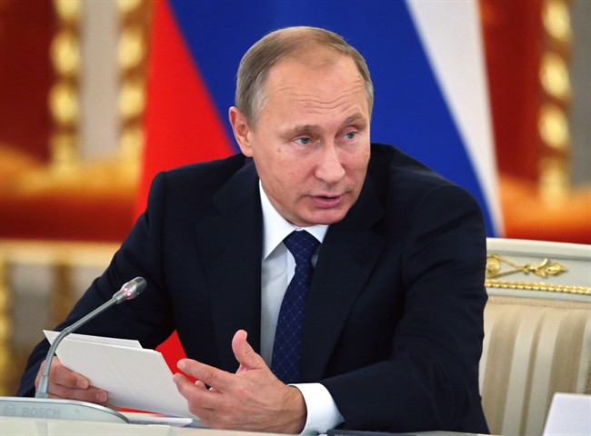 Russian President Vladimir Putin speaks as he heads a meeting of the Presidential Council for Civil Society and Human Rights at the Alexadrovsky Hall in the Kremlin in Moscow, Russia, Thursday, Oct. 1, 2015. (Yuri Kochetkov/Pool photo via AP).
