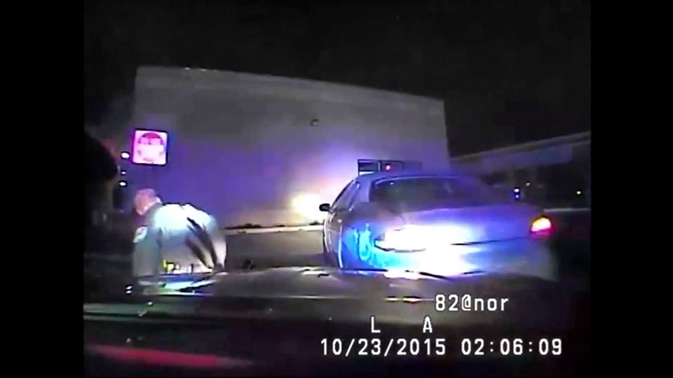 Caught on camera: Michigan woman slams car into police officer after traffic stop - image