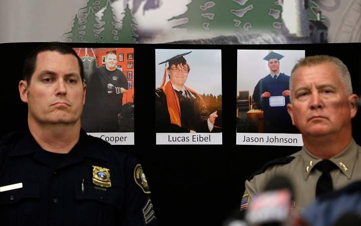 The photos of three of the victims of the mass shooting at Umpqua Community College are displayed at a news conference, Friday, Oct. 2, 2015, in Roseburg, Ore. In the photos, from left, are Quinn Cooper, 18, Lucas Eibel, 18, center, and Jason Johnson, 33.