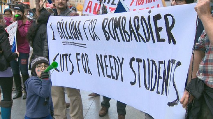 Striking teachers demonstrate in front of Bombardier offices after news of a massive bailout for the company was confirmed on Thursday, Oct. 29, 2015.