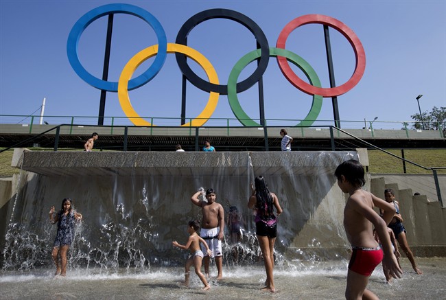  In this July 28, 2015 file photo, children play in a water fountain next to Olympic rings at Madureira Park in Rio de Janeiro, Brazil. 