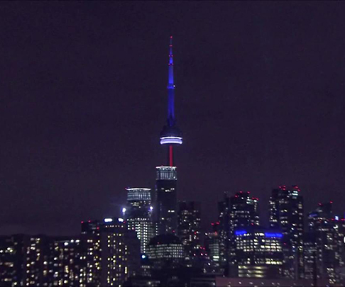 The CN Tower has been lit up in the colours of the French flag in the wake of the Paris attacks.