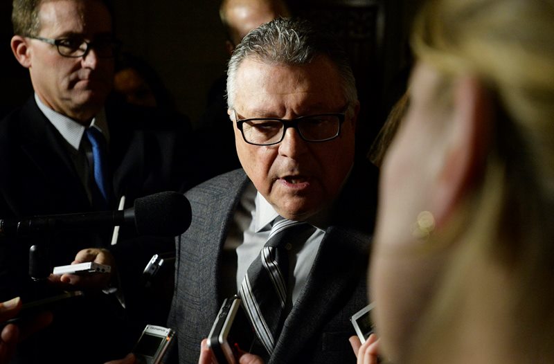 Public Safety Minister Ralph Goodale talks with media in Ottawa on Thursday, Nov. 12, 2015. 