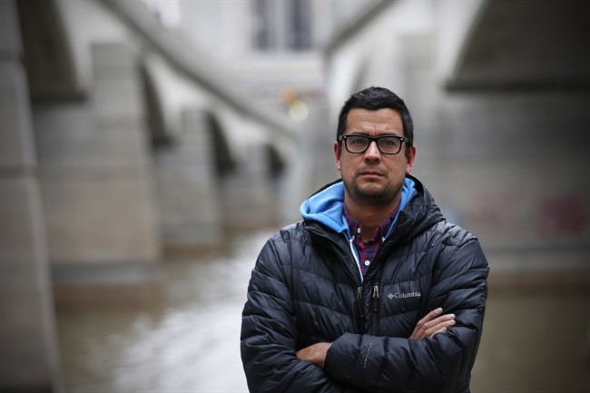 David Alexander Robertson, author of Betty: The Helen Betty Osborne Story, is photographed beside Winnipeg's Red River, Wednesday, November 11, 2015.