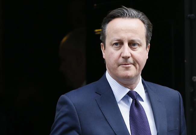 Britain's Prime Minister David Cameron leaves 10 Downing Street to attend Parliament in London, Thursday, Nov. 26, 2015.