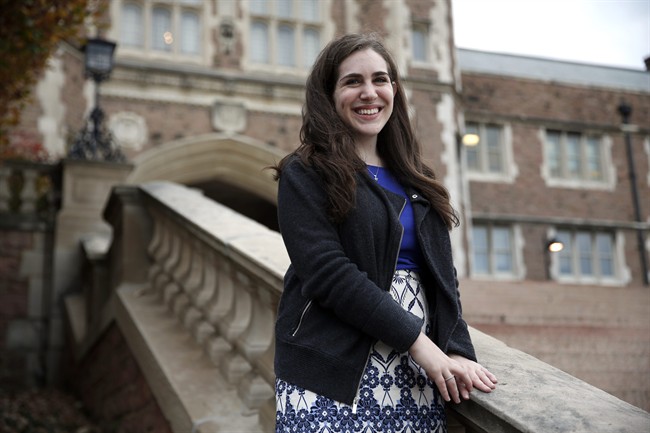 In this Wednesday, Nov. 4, 2015 photo, student Geena Kandel, 21, poses for a photo at Washington University in St. Louis. Kandel, a senior at the university, says she and her peers already worry that even a good college education won't be enough to help achieve what their parents have. "It puts a lot of pressure on people my age," she says.