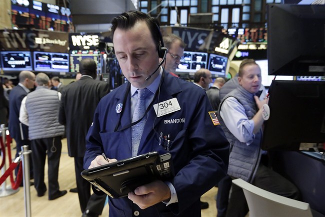 A trader works on the floor of the New York Stock Exchange, Monday, Nov. 2, 2015. 