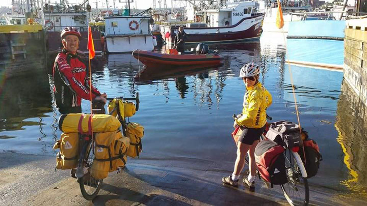 This photo shows Rob and Nancy Howse reaching the end of their second journey across Canada via bicycle.
