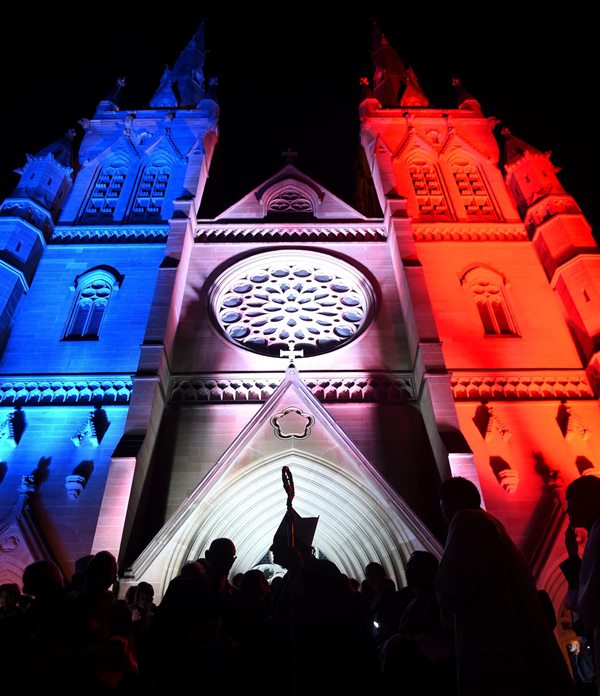 St Mary’s Cathedral as it is illuminated in the colours of the national flag of France, after he conducted a mass in honour of the victims and those affected by the recent Paris attacks, at St Mary’s Cathedral in Sydney, Australia, 16 November 2015.