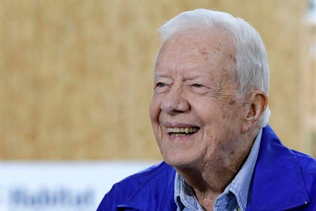 Former U.S. President Jimmy Carter is interviewed at a Habitat for Humanity project site in Memphis, Tenn. Carter said it’s too soon to tell whether treatment he received for his brain cancer has been effective, but that he hasn’t been uncomfortable or ill while receiving rounds of immune-boosting drugs.