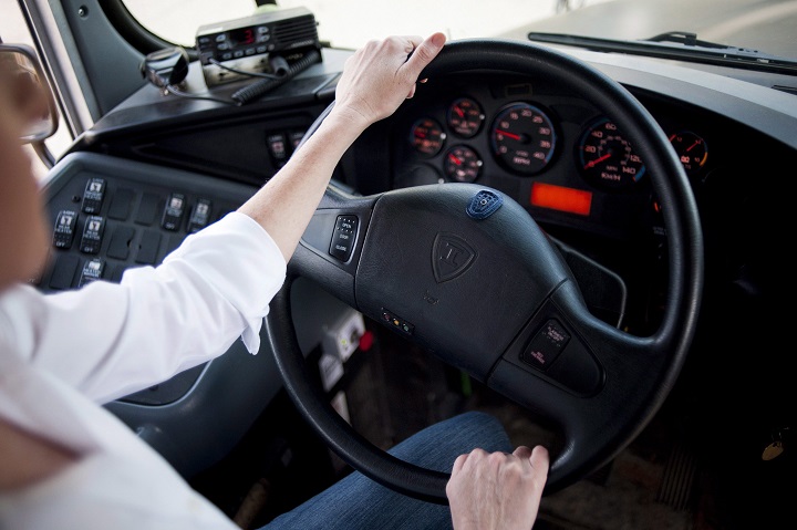 Catherine Carroll, COO and acting CEO of Sober Steering poses for a photo in a school bus in Kitchener, Ont., Thursday, Sept, 24, 2015. The bus has a steering wheel equipped with the company's biosensors that can detect if a driver has been drinking. THE CANADIAN PRESS/Marta Iwanek.
