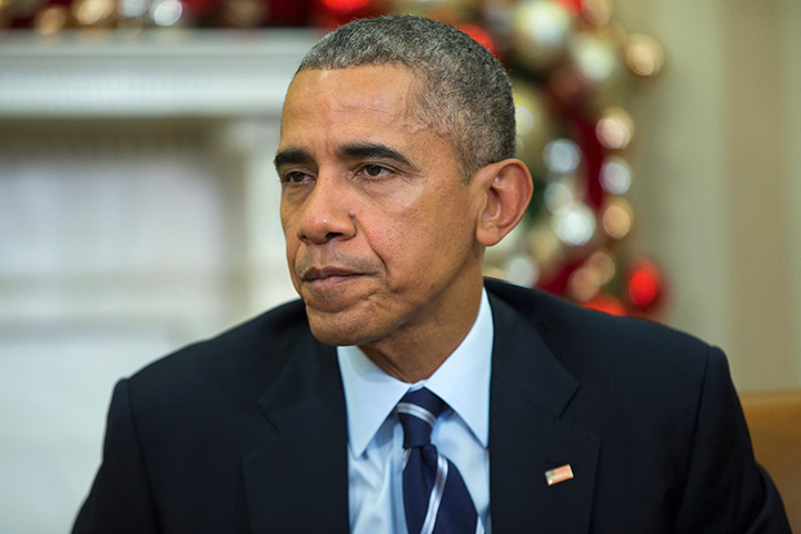 President Barack Obama makes a statement on Wednesday's mass shooting in San Bernandino, Calif., Thursday, Dec. 3, 2015, in the Oval Office of the White House in Washington. 