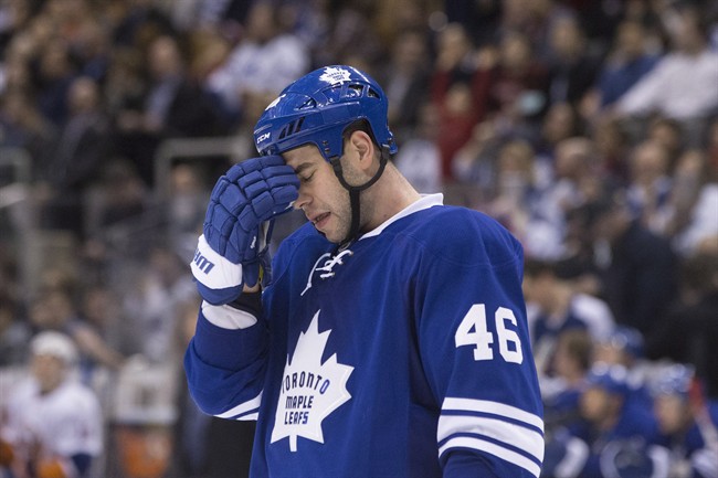 Toronto Maple Leafs\’ defenceman Roman Polak reacts as his team trails 6-2 to the New York Islanders during third period NHL hockey action, in Toronto, on Tuesday, December 29, 2015.