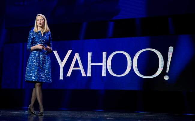FILE - In this Jan. 7, 2014, file photo, Yahoo president and CEO Marissa Mayer speaks during the International Consumer Electronics Show in Las Vegas. Yahoo announced Wednesday, Dec. 9, 2015, it is scrapping its original plan to spin off its prized stake in China’s Alibaba Group and will instead break off the rest of its business into a new company.