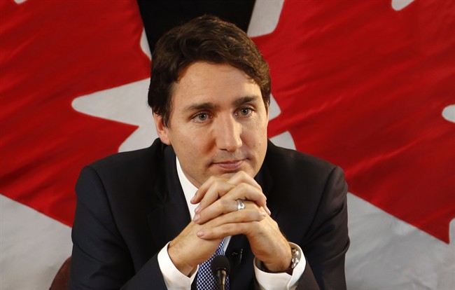 Prime Minister Justin Trudeau speaks with reporters during an interview with The Canadian Press in Ottawa on Wednesday, December 16, 2015. THE CANADIAN PRESS/ Patrick Doyle.