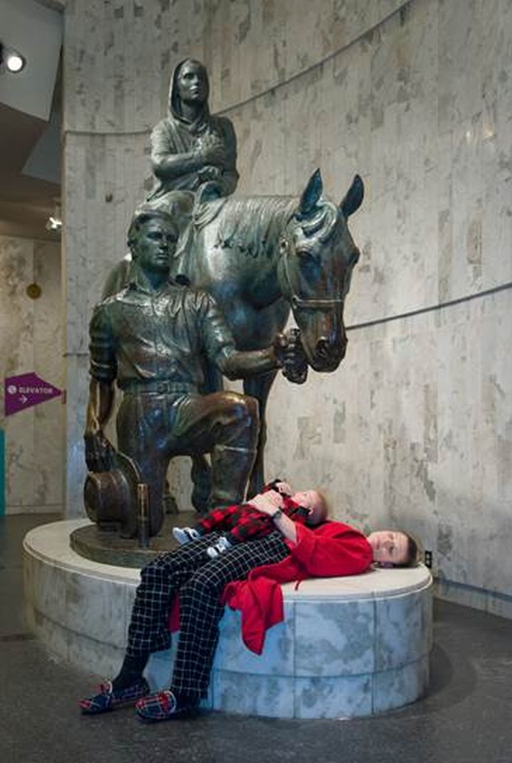 Tory Ansuwan and six-month-old Phoenix Ansuwan take advantage of a rare opportunity to put on their pajamas and spend a night at the Royal Alberta Museum.