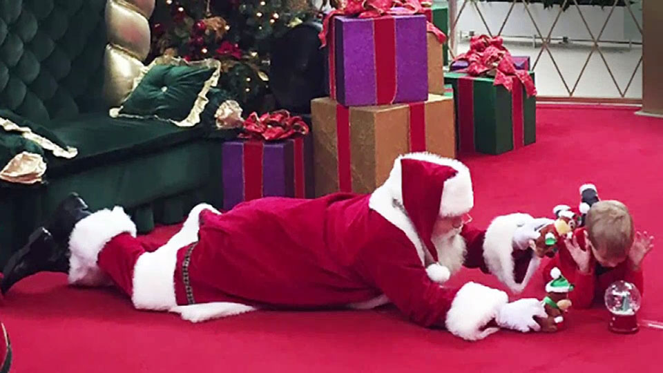‘Tis the season of understanding: why Santa Claus took a photo with a young boy on the floor - image