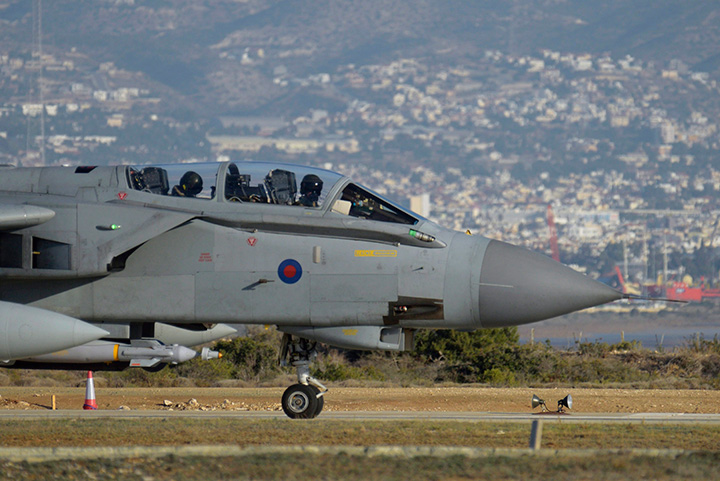 A British tornado warplane passes on the runway at the RAF Akrotiri, a British air base near coastal city of Limassol, Cyprus, Thursday, Dec. 3, 2015 after an airstrike. U.S. and coalition airstrikes killed 10 Islamic State leaders over the past month, including several linked to the Paris attacks or other plots against the West, a U.S. military official in Iraq said Tuesday. 