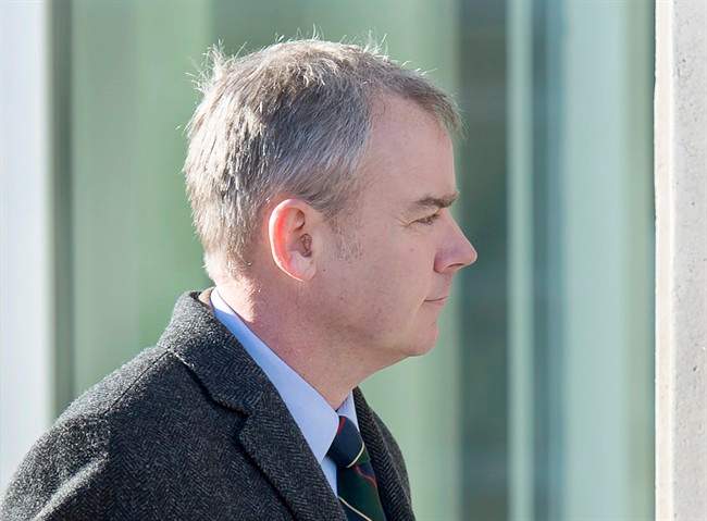 Dennis Oland heads to the Law Courts where he was found guilty of second degree murder in the death of his father, Richard Oland, in Saint John, N.B. on Saturday, Dec. 19, 2015.