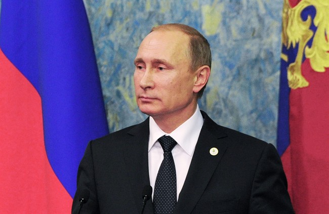 Russian President Vladimir Putin speaks to the media after the COP21 UN Conference on Climate Change in Paris, France, Monday, Nov. 30, 2015. Putin said Monday that he and President Barack Obama have a shared understanding on how to move toward a political settlement in Syria, but added that incidents like the recent downing of a Russian warplane by a Turkish fighter jet stymie broader cooperation against extremism.