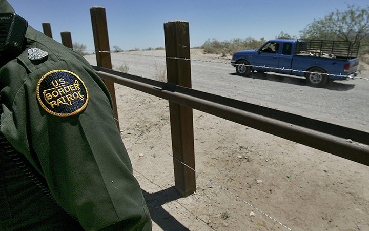 A truck passes on the Mexican side of the border with Arizona.