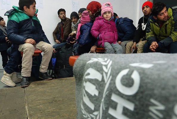 German police search migrants and refugees arriving from Austria at a processing center on January 27, 2016 in Passau, Germany. The flow of migrants arriving in Passau has dropped to between 500 and 1,000 per day, down significantly from last November, when in the same region up to 6,000 migrants were arriving daily. German police only allows migrants to enter who say they will apply for asylum in Germany. Those who say they want to continue to other countries, such as Denmark or Sweden, are denied entry and brought back to Austria.