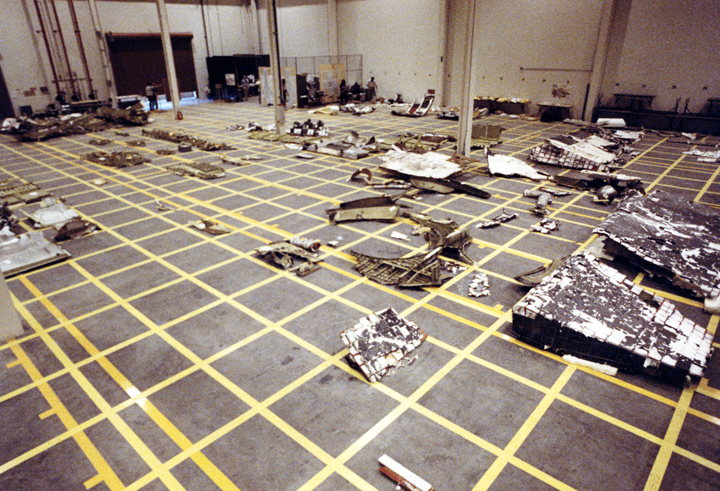 Pieces of the Space Shuttle Challenger are arranged in a hangar after being salvaged from the Atlantic Ocean where they were scattered, on January 28, 1986 when the spacecraft exploded.