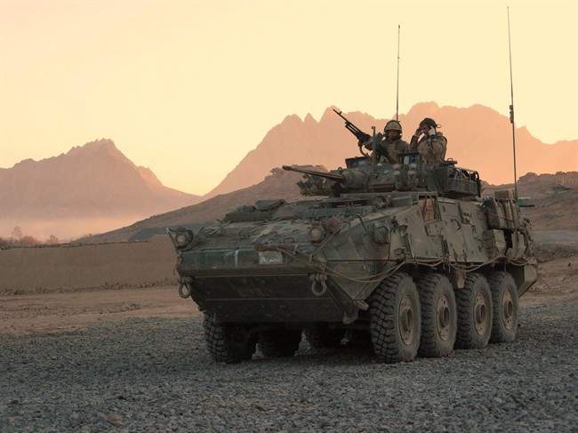 In this file photo a Canadian LAV (light armoured vehicle) arrives to escort a convoy at a forward operating base near Panjwaii, Afghanistan.