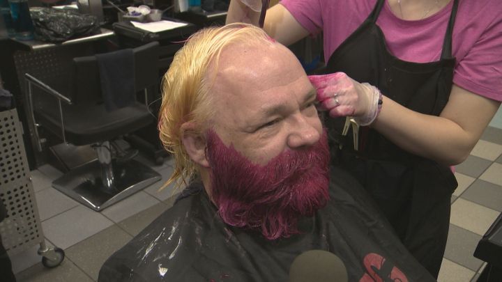 Clifford Kruger dyes his hair and beard for the annual Hair Massacure.