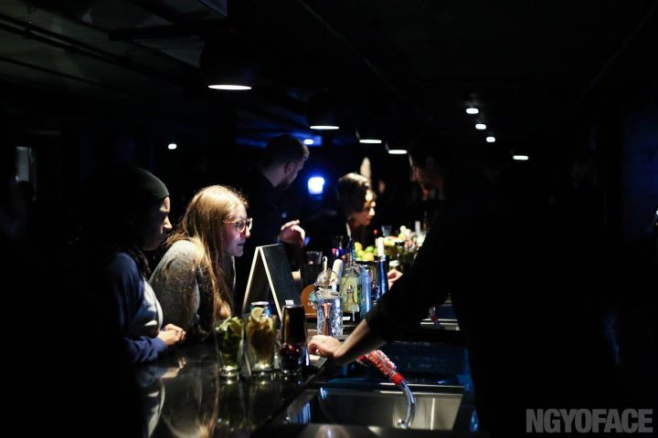 People having drinks at the Chvrch of John at a popup event on Dec. 23, 2015.