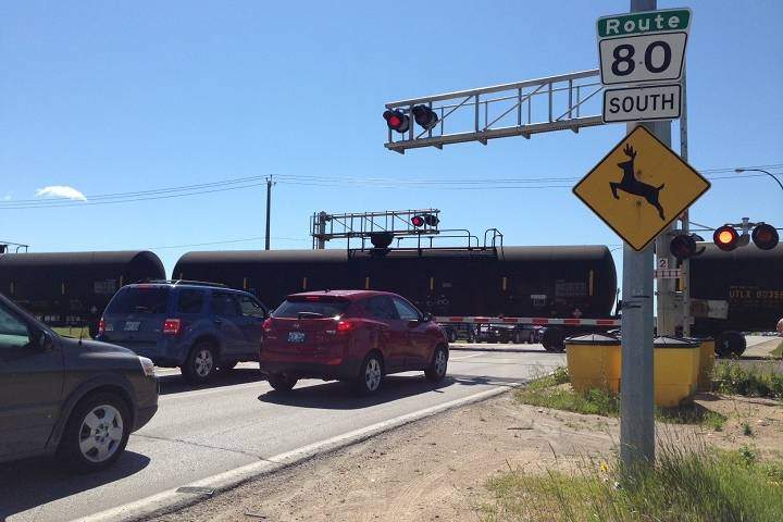 A train rumbles by at the location of the future Waverley Street underpass.