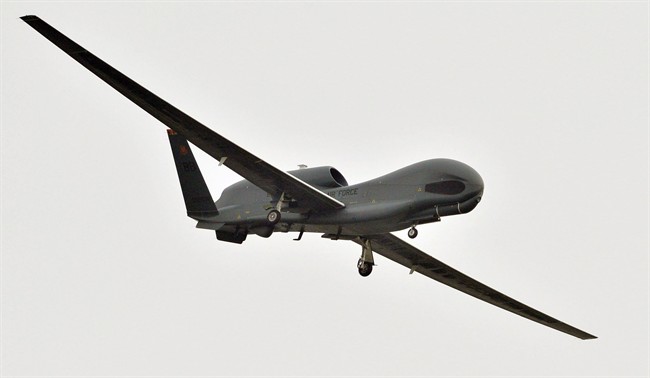 A U.S. Global Hawk surveillance drone prepares to land at the Misawa Air Base in Misawa, northern Japan, Saturday, May 24, 2014. 