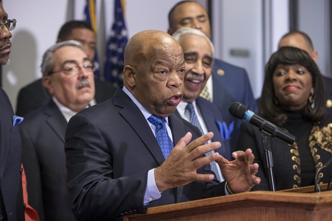 Rep. John Lewis, D-Ga., a leader of the civil rights movement, joins the Congressional Black Caucus Political Action Committee in endorsing Democratic Presidential candidate Hillary Clinton as prominent African-American Democrats rush to her aid ahead of the Feb. 27 Democratic primary in South Carolina, Thursday, Feb. 11, 2016, during a news conference on Capitol Hill in Washington.