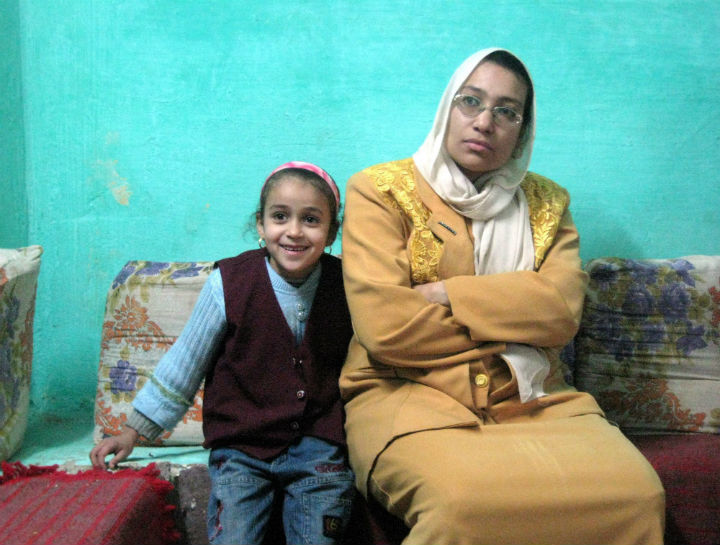 Maha Mohammed, right, and her daughter Rehab, left, listen to workers from a local rights group, not pictured, who explain the dangers of female circumcision during a visit to Mohammed's home in the Egyptian village of Sultan Zawyit on Dec. 5, 2015. (File photo).
