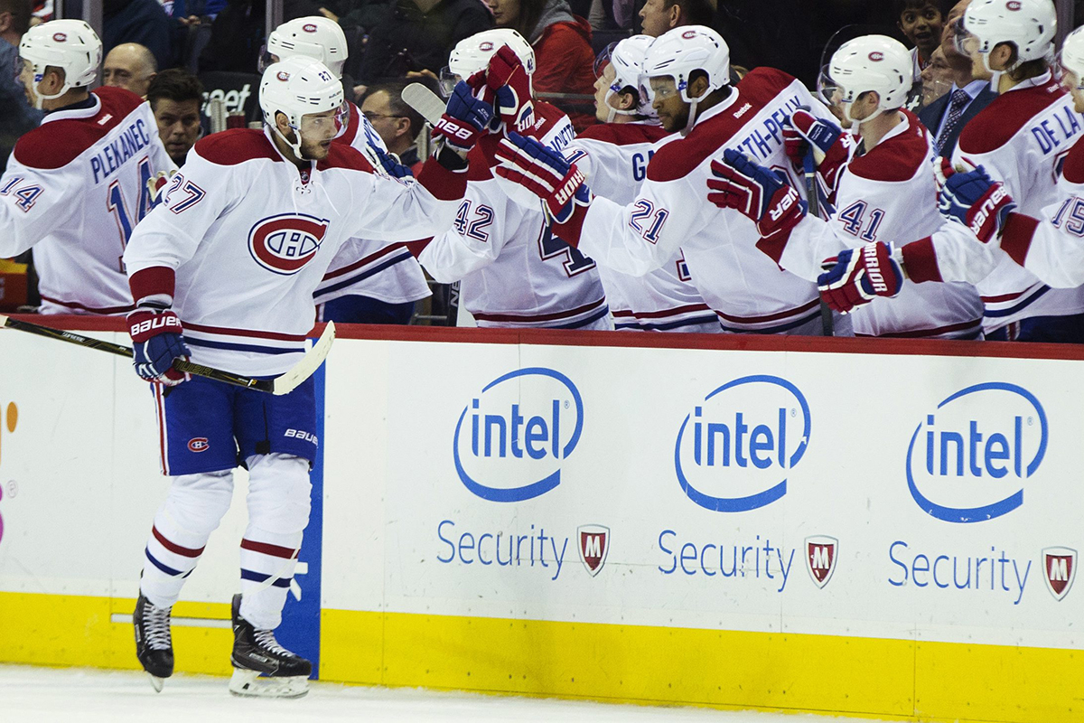 Montreal Canadiens center Alex Galchenyuk (27) is congratulated by teammates after scoring a second period goal against the Washington Capitals during an NHL hockey game, on Wednesday, Feb. 24, 2016, in Washington. 