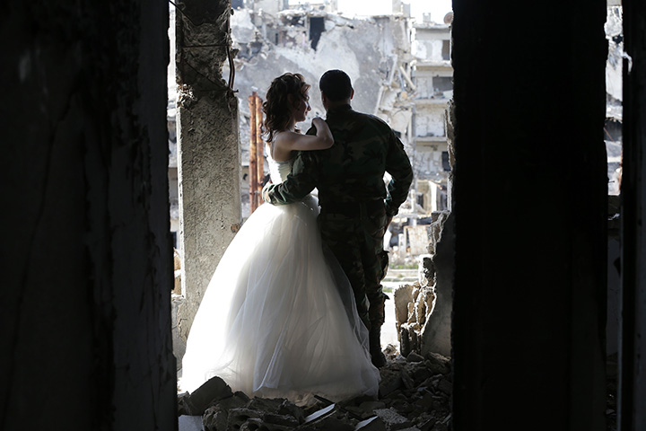 IN PHOTOS: Newlywed Syrian couple pose for wedding pictures amid ruins of war-ravaged city of Homs - image