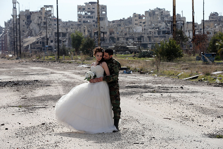 IN PHOTOS: Newlywed Syrian couple pose for wedding pictures amid ruins of war-ravaged city of Homs - image