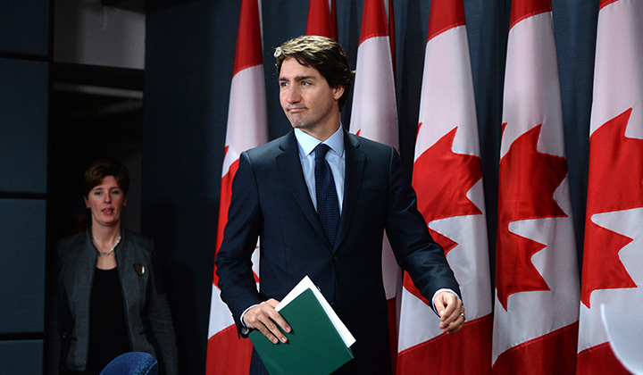 Prime Minister Justin Trudeau arrives at a press conference at the National Press Theatre in Ottawa on Monday, Feb. 8, 2016. 