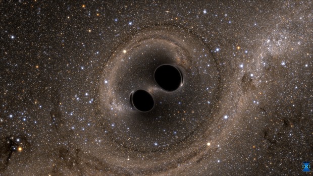 The collision of two black holes holes—a tremendously powerful event detected for the first time ever by the Laser Interferometer Gravitational-Wave Observatory, or LIGO—is seen in this still from a computer simulation.