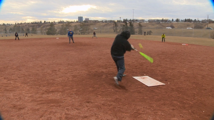Calgarians play a little pick-up softball Feb. 28.
