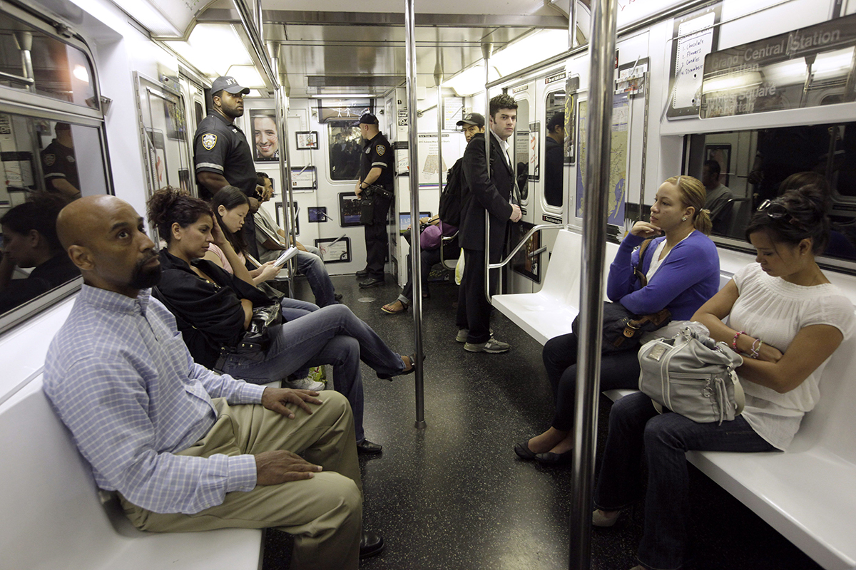 In this Sept. 11, 2011 file photo, people ride a New York City subway train. Researchers from Weill Cornell and scientists at the American Museum of Natural History have traced bedbugs through the city's subway system and discovered a genetic diversity among the bloodsucking creatures. 