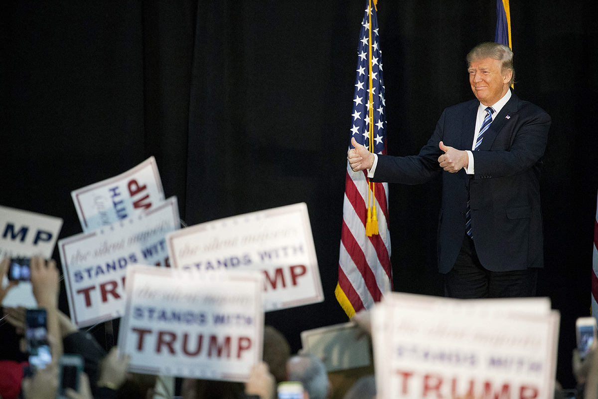Republican presidential candidate Donald Trump steps on stage to speak during a campaign event at Plymouth State University Sunday, Feb. 7, 2016, in Plymouth, N.H.