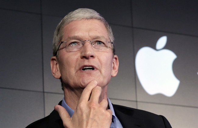 Apple CEO Tim Cook responds to a question during a news conference in New York. Apple Inc. on Thursday asked a federal magistrate to reverse her order that the company help the FBI hack into a locked iPhone, accusing the federal government of seeking "dangerous power" through the courts.