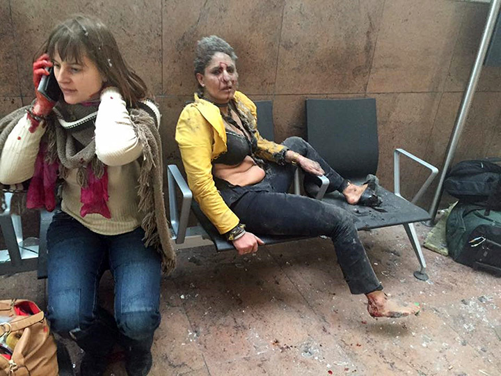 In this photo provided by Georgian Public Broadcaster and photographed by Ketevan Kardava two women wounded in Brussels Airport in Brussels, Belgium, after explosions were heard Tuesday, March 22, 2016.