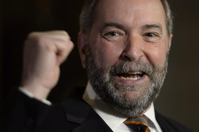 NDP Leader Tom Mulcair speaks to reporters in the Foyer of the House of Commons in Ottawa on Wednesday, Dec. 2, 2015. 