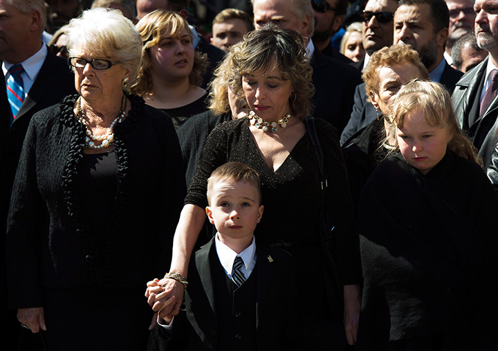 Mother Diane Ford, left to right, son Doug Ford Jr., wife Renata Ford and daughter Stephanie Ford wait outside city hall ahead of the funeral procession to St. James Cathedral for former mayor Rob Ford in Toronto on Wednesday, March 30, 2016.