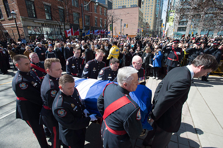 An honour guard carries the casket of former Toronto mayor Rob Ford into St. James Cathedral in Toronto on Wednesday, March 30, 2016.