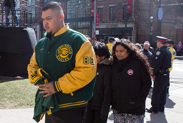 A man wearing a Don Bosco Eagles football jacket arrives at Toronto’s St. James Cathedral for Rob Ford’s funeral service on Wednesday, March 30, 2016.