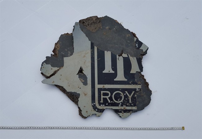 FILE - In this Monday, March 21, 2016, a part of a plane is photographed in Mossel Bay, near Cape Town, South Africa. The part which may be part of a plane engine has been found on the southern coast of South Africa and will be checked to see if it belongs to Malaysia Airlines Flight 370, which vanished two years ago, Malaysian Tranport Minister Liow Tiong Lai said Tuesday, March 22, 2016.